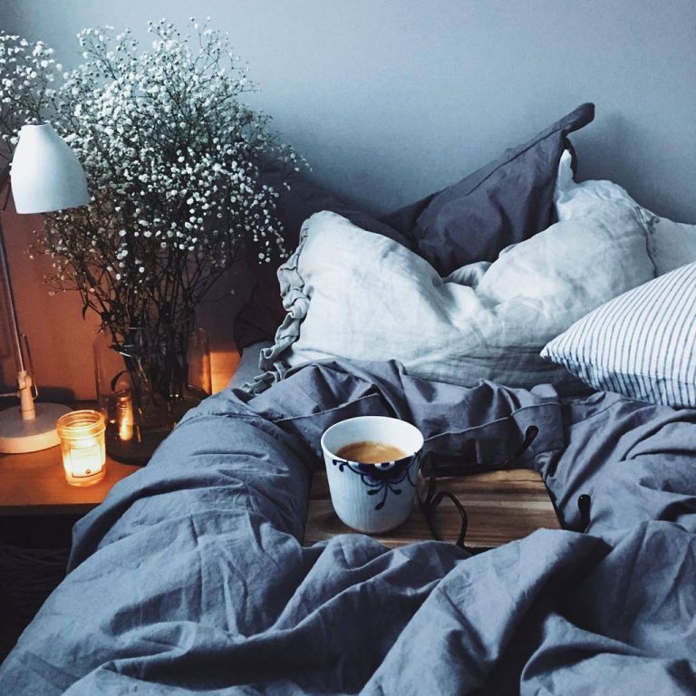 cosy bedding with cup of tea