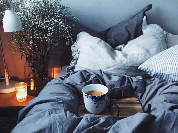 cosy bedding with cup of tea