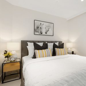 White bedroom with oak