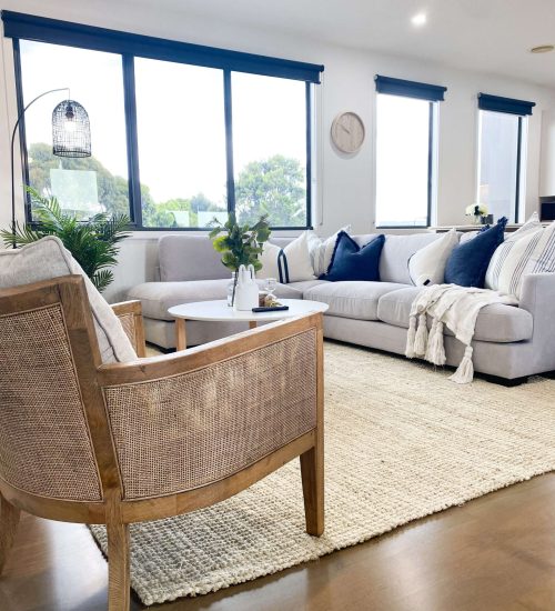 Hamptons living room design with rattan chair