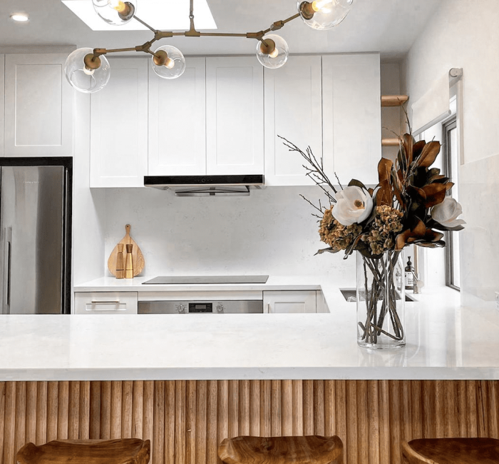 big glass and brass pendant over island