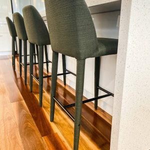 green fabric barstools